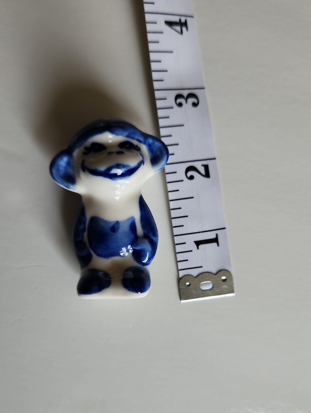 Blue and White Ceramic Small Monkey Figurine .